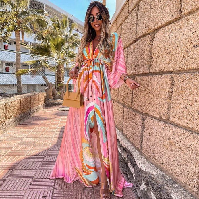 Women's V-neck maxi dress with elegant kimono sleeves & high slit, perfect for summer occasions.