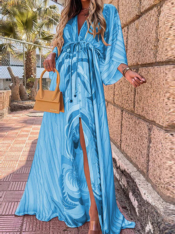 Flowy women's long dress, V-neck, kimono sleeve & high slit. Ideal for beach, evening, or elegant events.