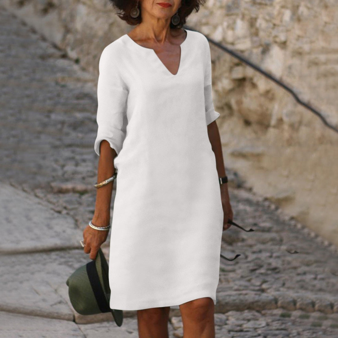 Effortless V-neck midi dress, women's relaxed fit, easily transitions from day to night.