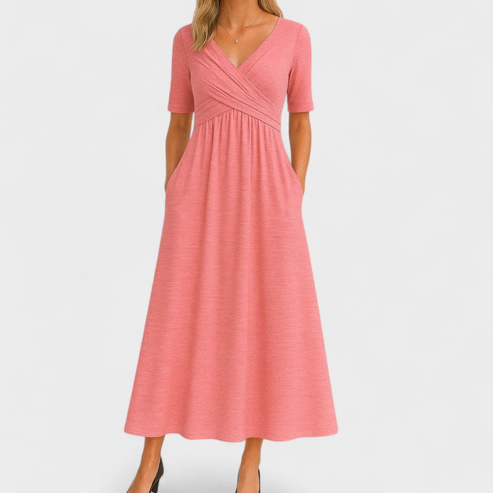 Chic women's V-neck midi dress, perfect for work or casual style, featuring a comfortable flowy fit & pockets.