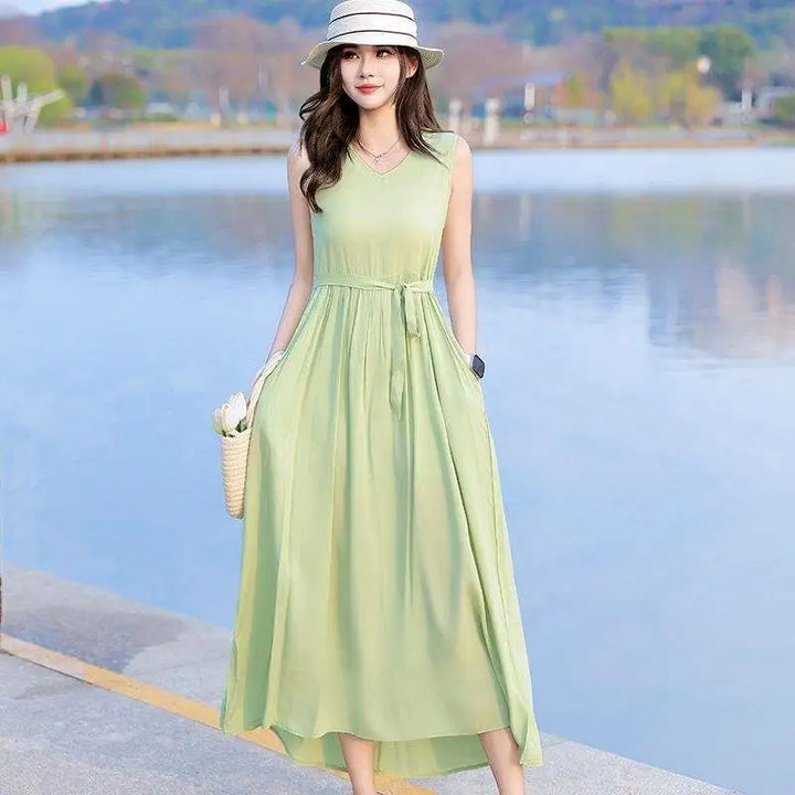 Sleeveless V-neck maxi dress for women, featuring a stylish tie waist for a flattering fit.