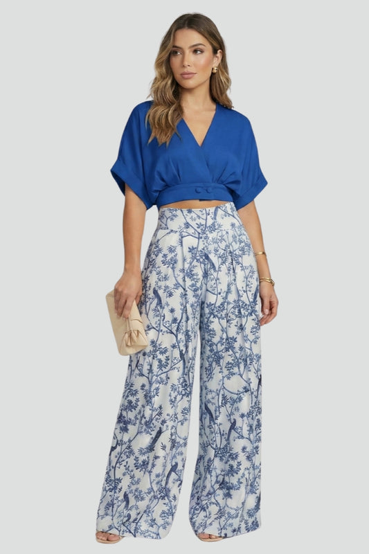 Fashionable women's two-piece V-neck top with wide leg trousers, ideal for stylish summer outfits.