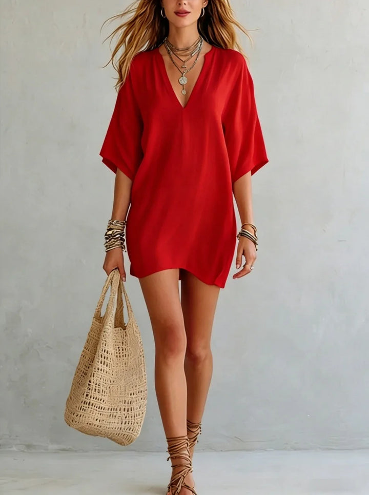 Chic V-neck tunic mini dress for women, a relaxed fit summer dress perfect as beachwear or casual outfit.