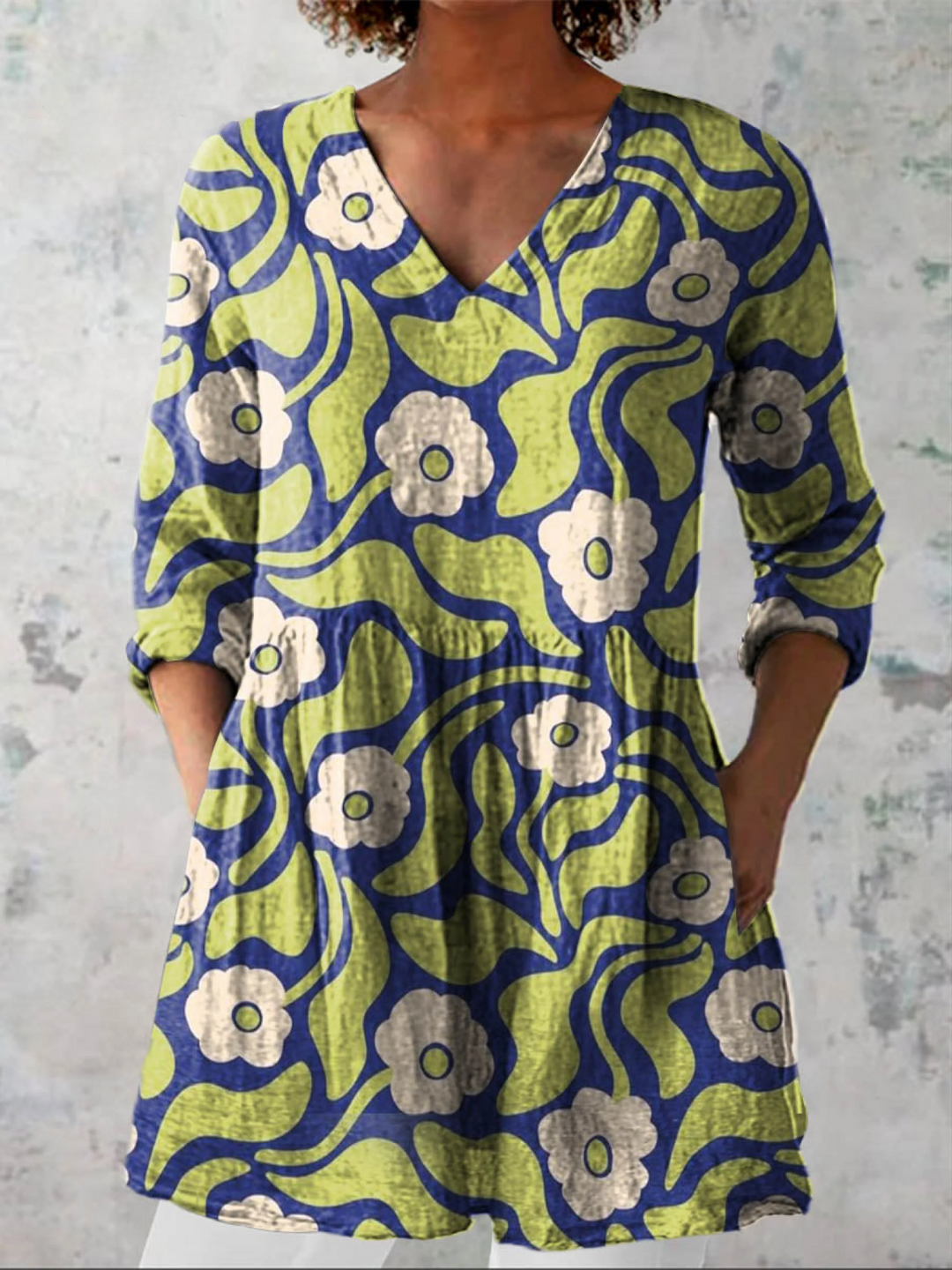 Women's V-neck tunic top with pockets. Loose fit, comfortable longline beachwear or casual summer shirt.
