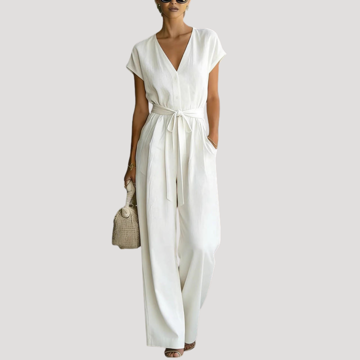 Women's V-neck wide-leg jumpsuit with tie waist. Elegant, comfortable one-piece for summer fashion.