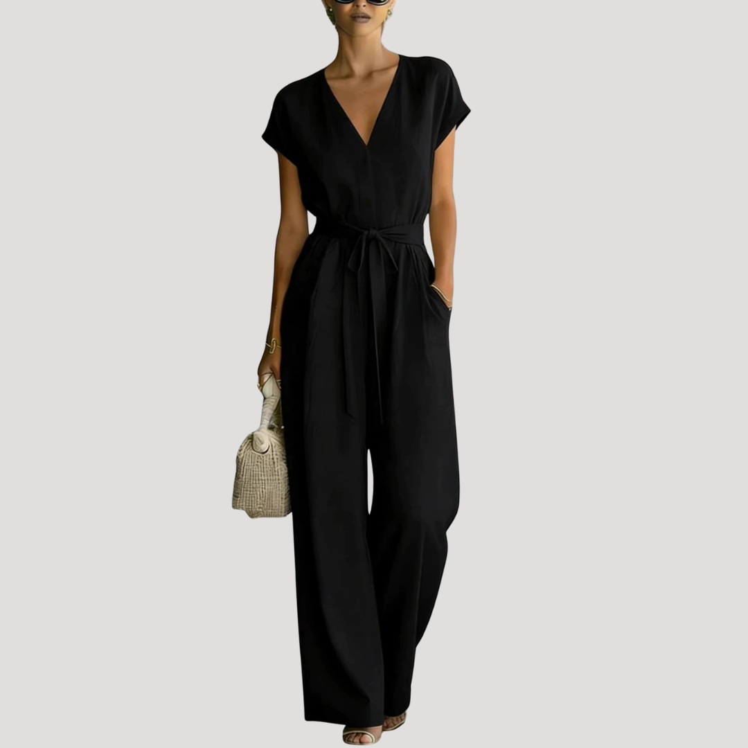 Chic women's V-neck jumpsuit featuring a flattering tie waist and comfortable wide-leg silhouette.