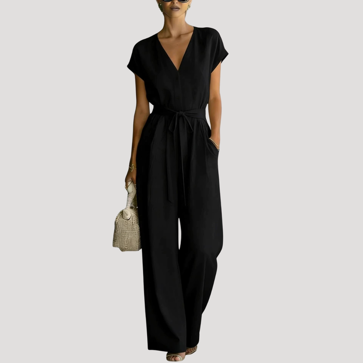 Chic women's V-neck jumpsuit featuring a flattering tie waist and comfortable wide-leg silhouette.