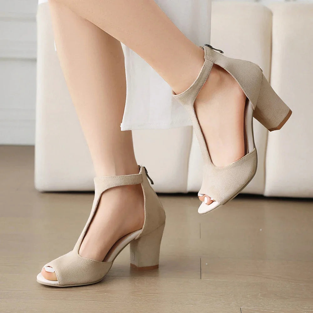 Versatile black Valdora block heels. Chic women's T-strap, open-toe footwear, perfect for comfortable day-to-evening style.