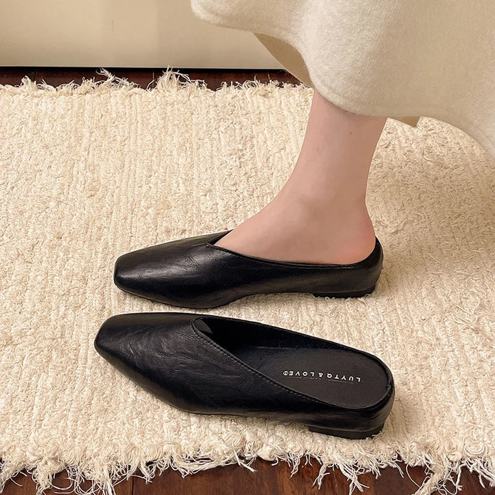 Casual women's vegan leather flats, effortless slip-on footwear for daily comfort.