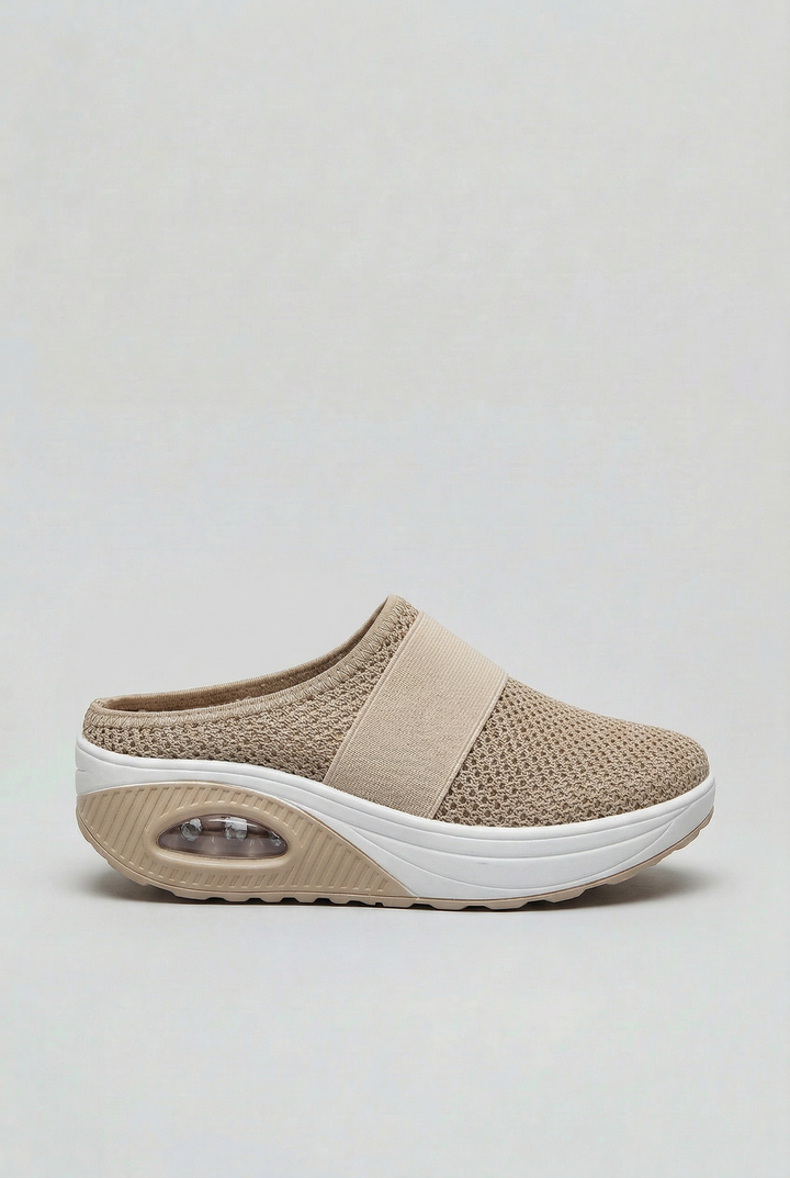 Women's ventilated slip-on mules with air cushion comfort for everyday casual wear.