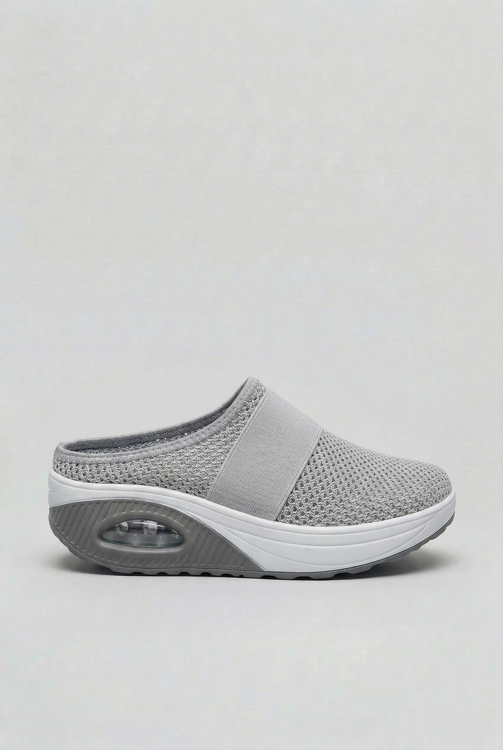 Air cushion women's mules, slip-on and ventilated for ultimate everyday comfort in casual settings.