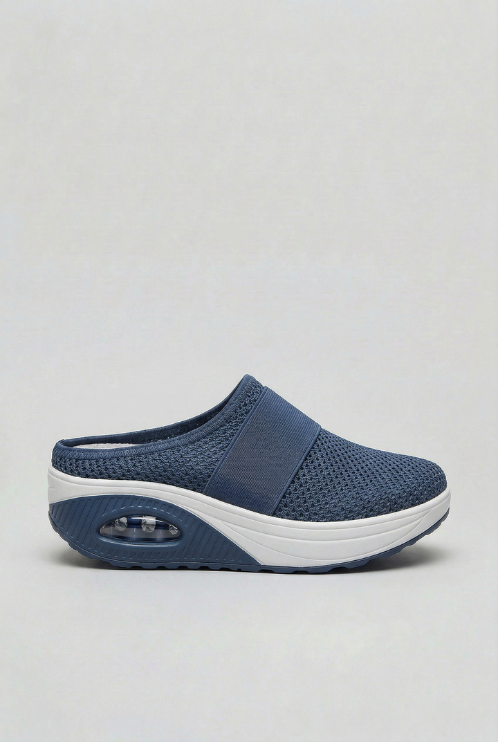 Stylish women's ventilated open-back mules offering air cushion comfort for casual everyday wear.