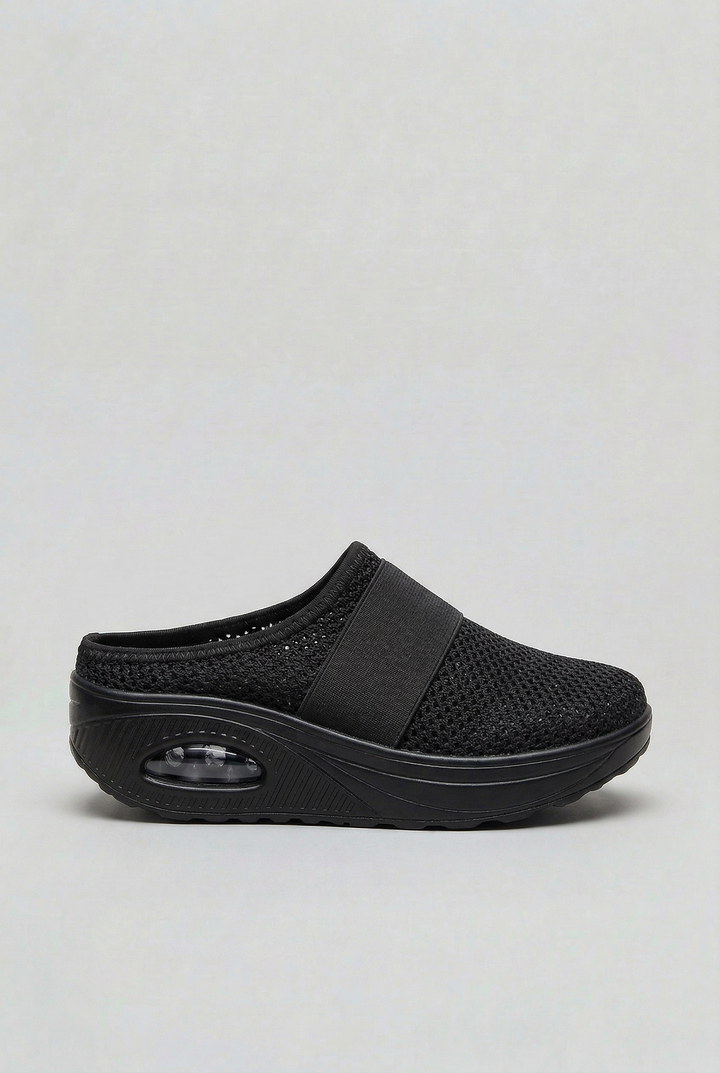 Women's comfort mules, slip-on style with ventilated design & shock-absorbing air cushion.