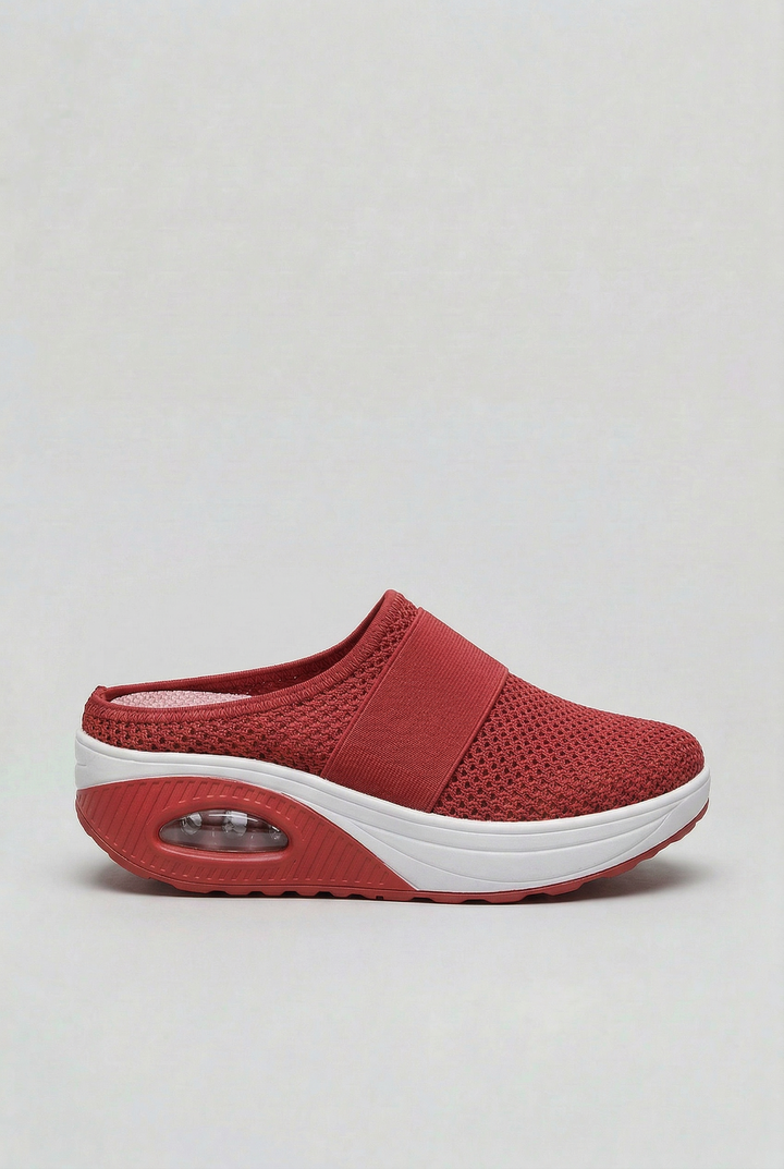 Women's breathable slip-on mules featuring an air cushion sole for ultimate casual comfort.