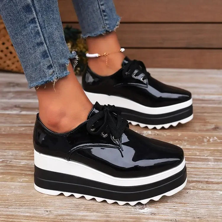 Elevated women's Verona platform sneakers. Glossy finish, providing fashion-forward casual footwear.