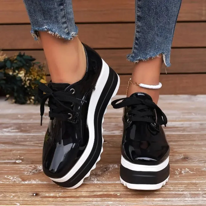 Sporty-chic women's Verona Gloss platform sneakers. Comfortable lace-up design for active, stylish wear.
