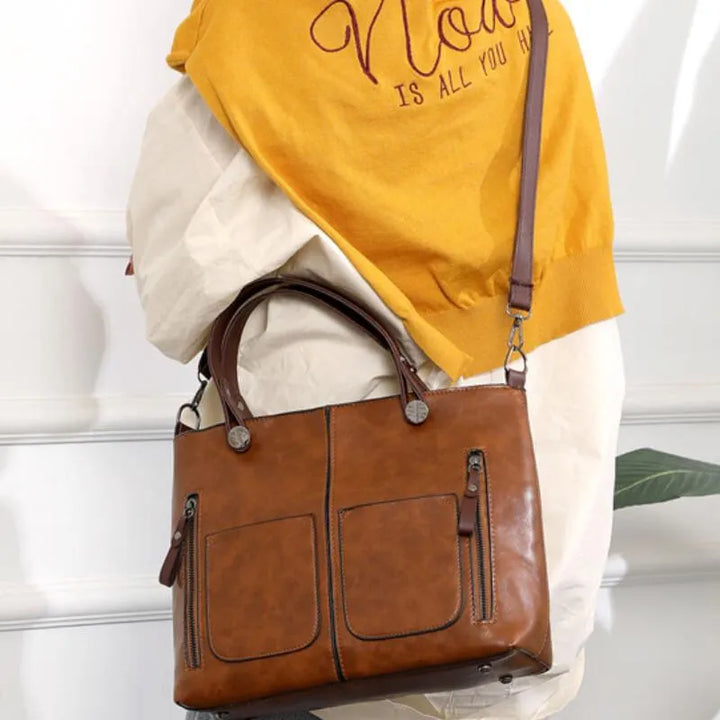 Spacious women's tote bag with organizational features, durable for everyday use, stylish accessory.