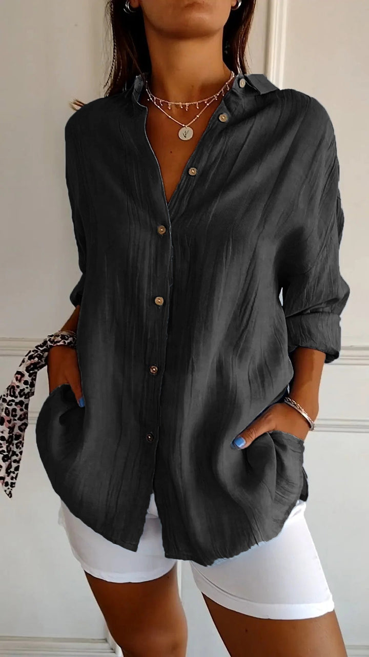 Oversized women's long sleeve button-down shirt, a versatile casual blouse for everyday style.