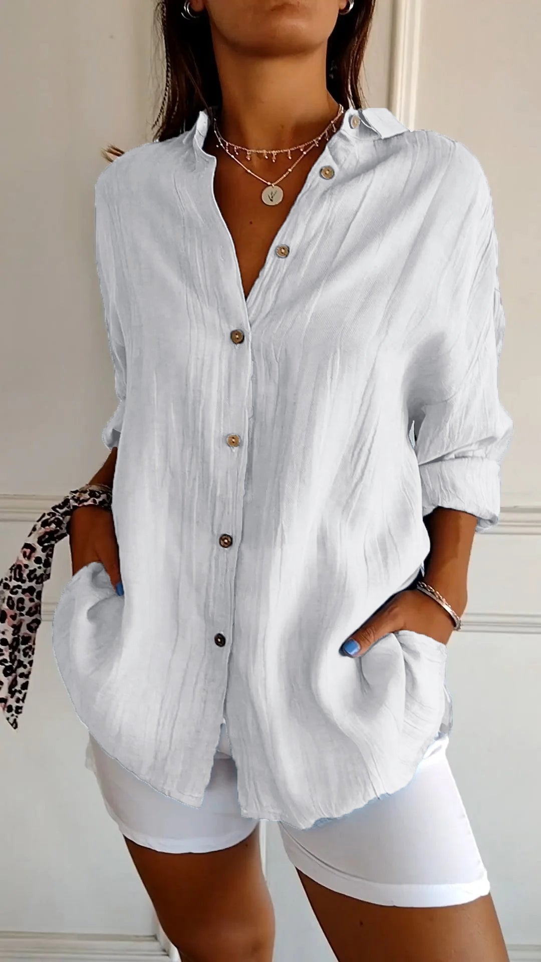 Relaxed fit women's long sleeve button-down top, a versatile blouse for summer fashion or spring style.
