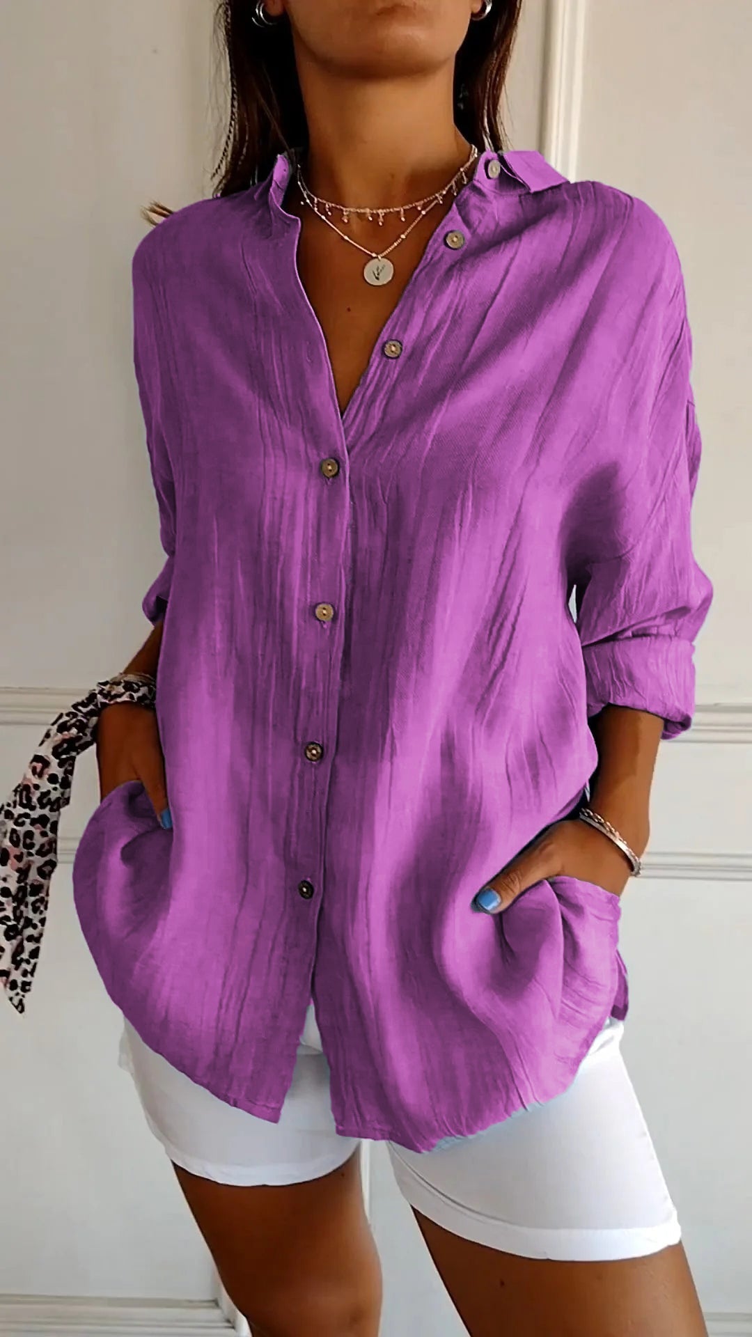 Chic women's versatile long sleeve button-down shirt, a relaxed fit blouse for sophisticated everyday wear.