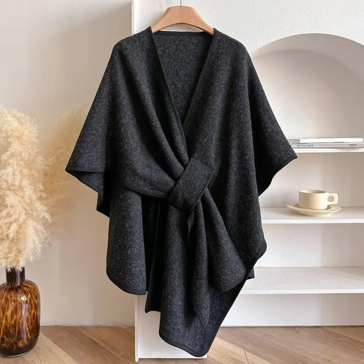 Versatile women's shawl poncho, a cozy all-season scarf coat for stylish layering and comfort.