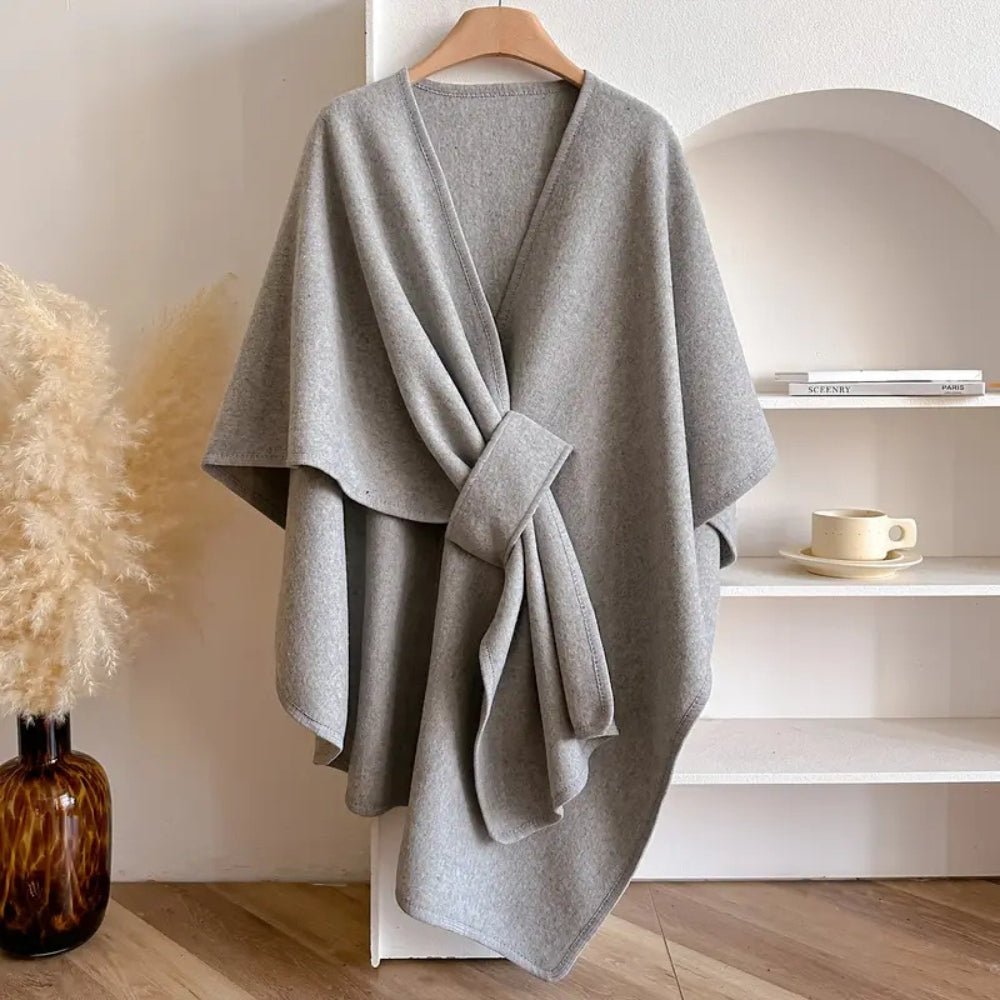 Chic women's poncho scarf coat, perfect versatile wrap for elegant all-season fashion accessory.