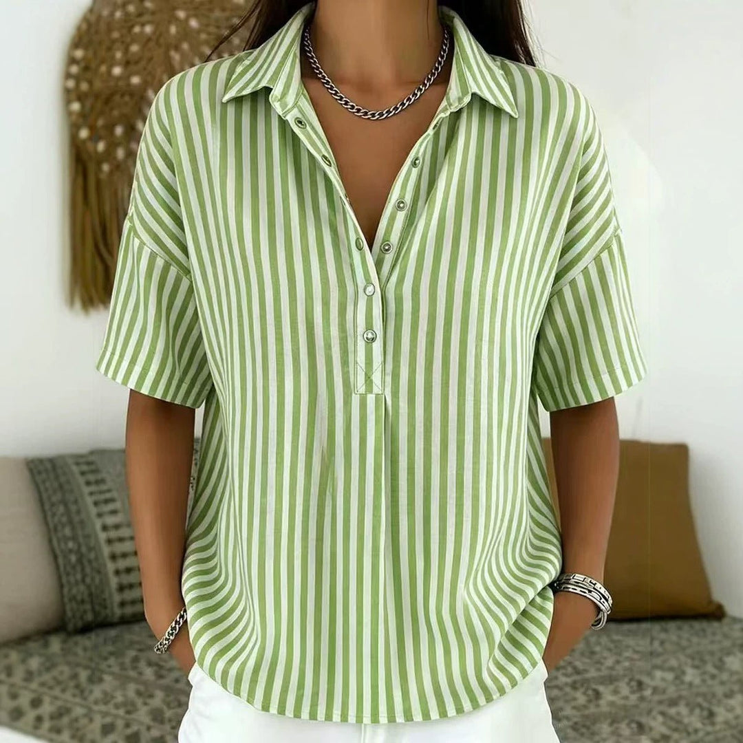 Versatile women's vertical stripe blouse. Relaxed fit, short sleeve, half-button, ideal for work or casual wear.