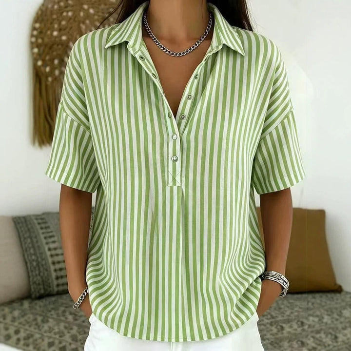 Versatile women's vertical stripe blouse. Relaxed fit, short sleeve, half-button, ideal for work or casual wear.