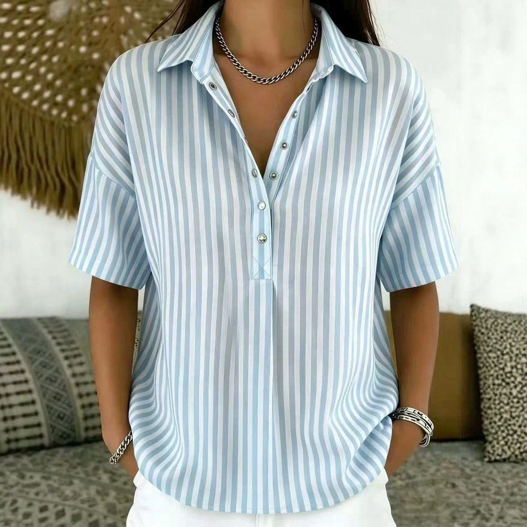 Short sleeve women's vertical stripe blouse. Relaxed fit, half-button, perfect for spring/summer workwear.