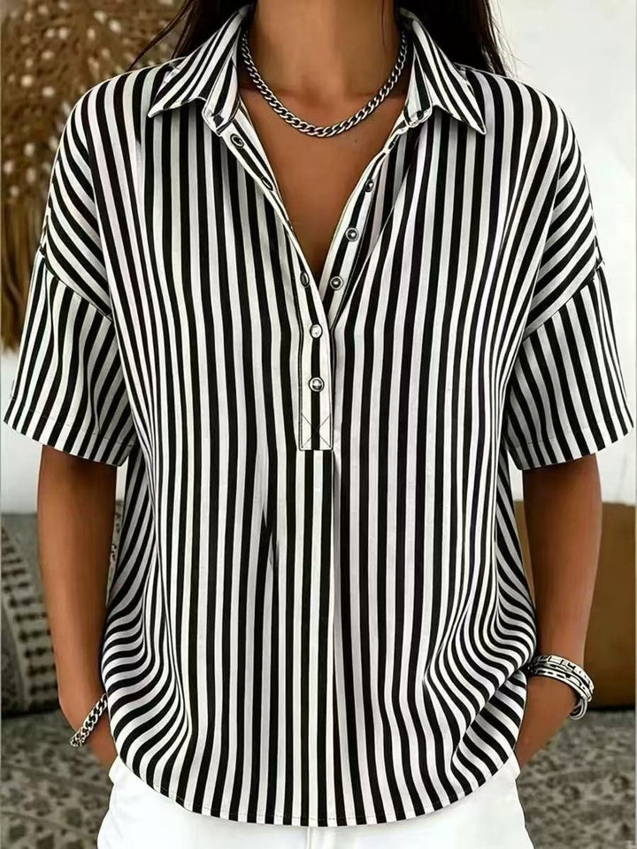 Women's relaxed fit half-button top. Stylish vertical stripes for a breezy, casual summer look.