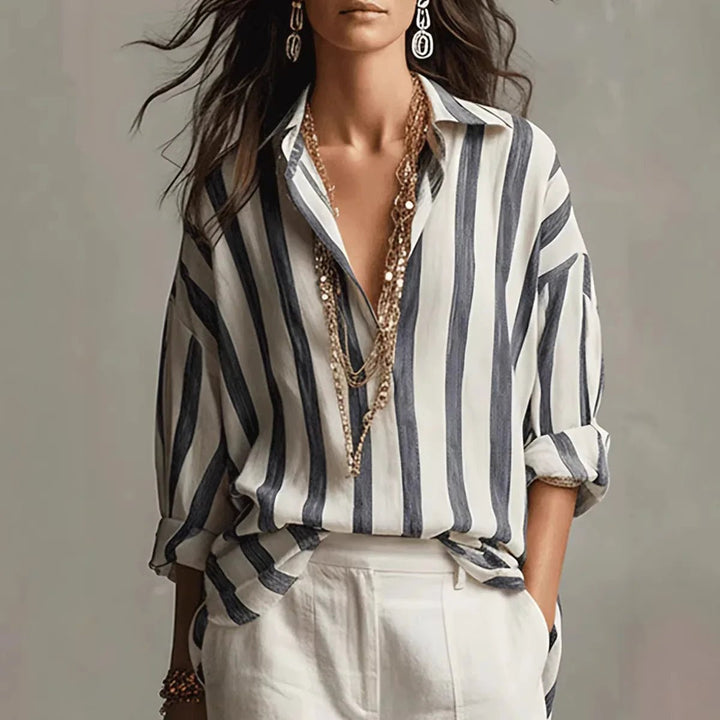 Women's vertical stripe long-sleeve blouse with an open collar, perfect for elegant casual wear or workwear.