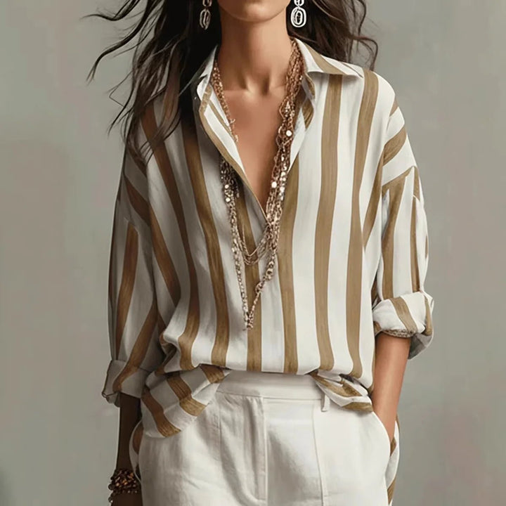 Relaxed fit women's vertical stripe blouse. Versatile long-sleeve top for spring, summer, and casual workwear.