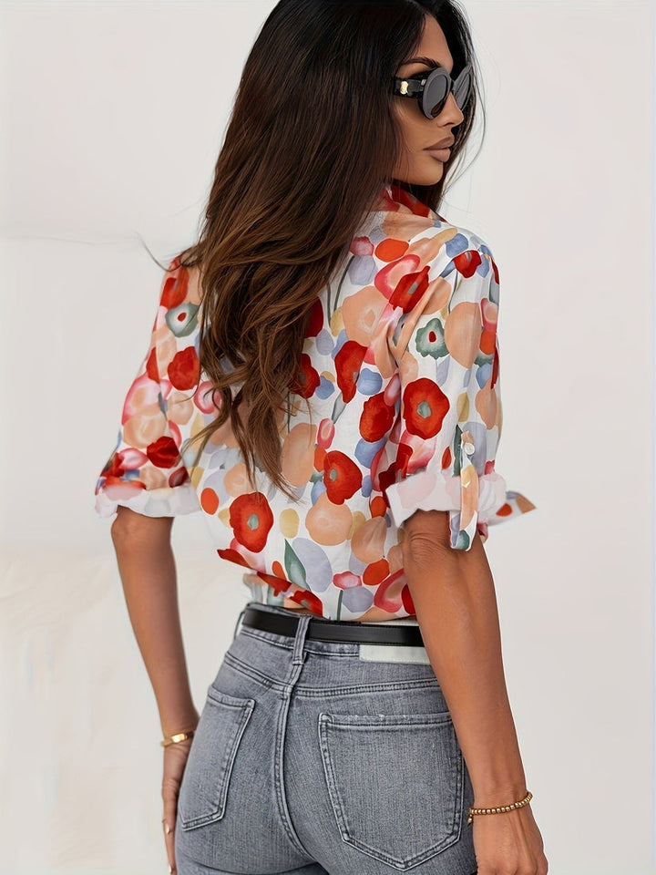 Relaxed fit women's long sleeve abstract floral button down blouse. Vibrant print, comfortable & trendy.