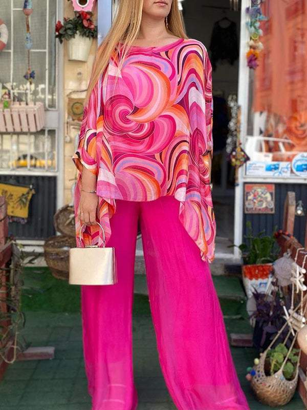 Women's casual yet chic abstract print batwing top & wide leg pant set, ideal for lounging.