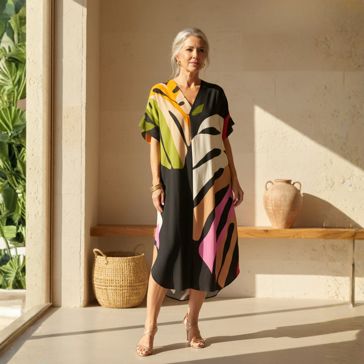Women's vibrant abstract print V-neck shift dress with short sleeves.