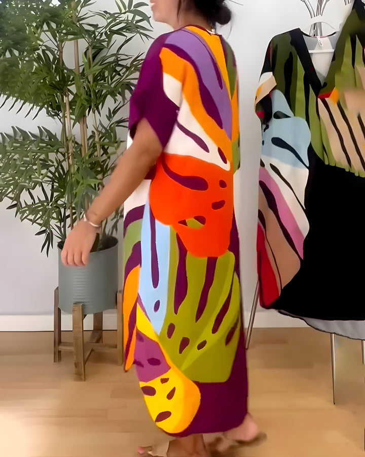 Women's casual vibrant abstract print V-neck shift dress, versatile for spring/summer comfort.