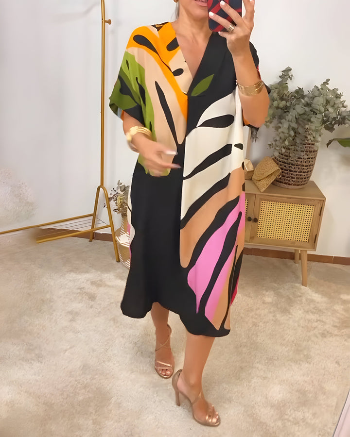 Artistic women's abstract print V-neck shift dress, colorful & comfortable for casual spring fashion.