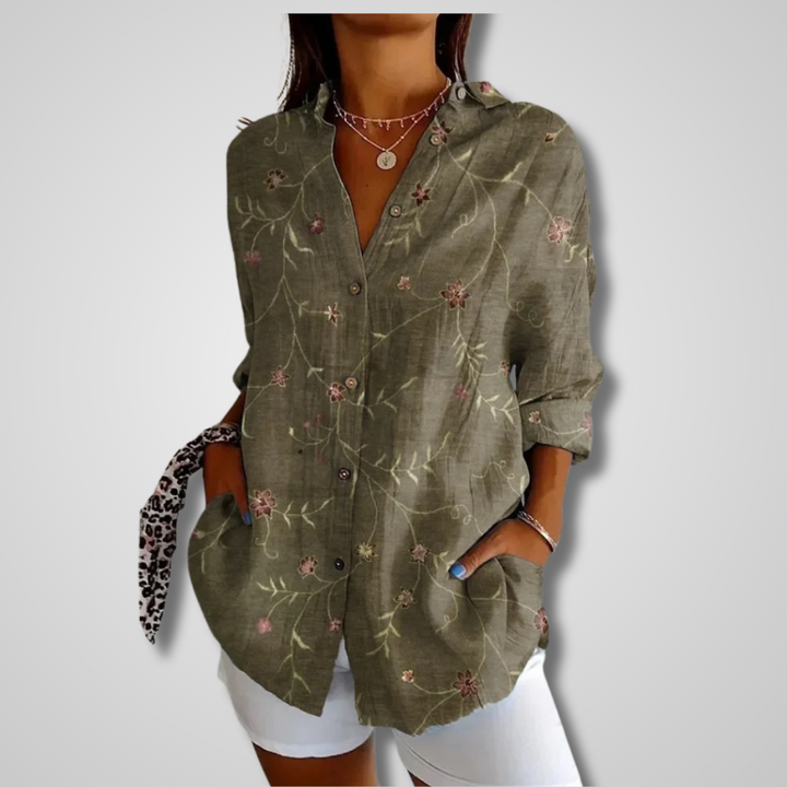 Casual women's button-up blouse featuring a vibrant artistic bohemian print and comfortable long sleeves.
