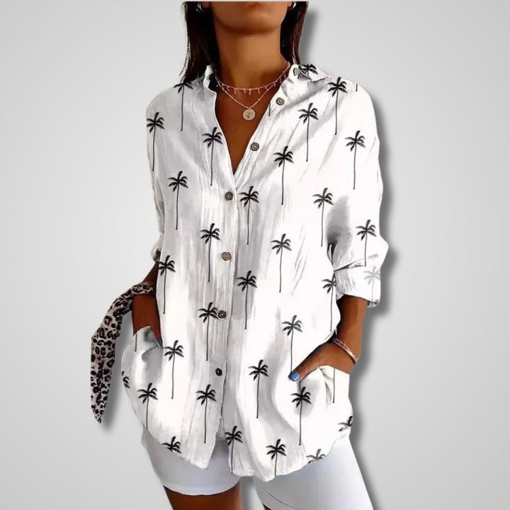 Bohemian style women's blouse, a vibrant artistic print button-up top with a relaxed fit & long sleeves.