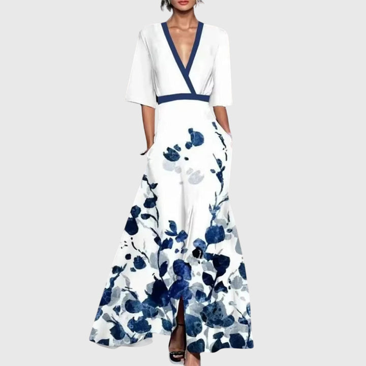 Women's vibrant bold floral maxi dress with elegant V-neck and stylish contrast trim, perfect for summer parties.