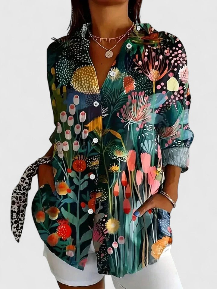 Elegant women's long sleeve blouse with a bold floral abstract print, perfect for adding color to your look.