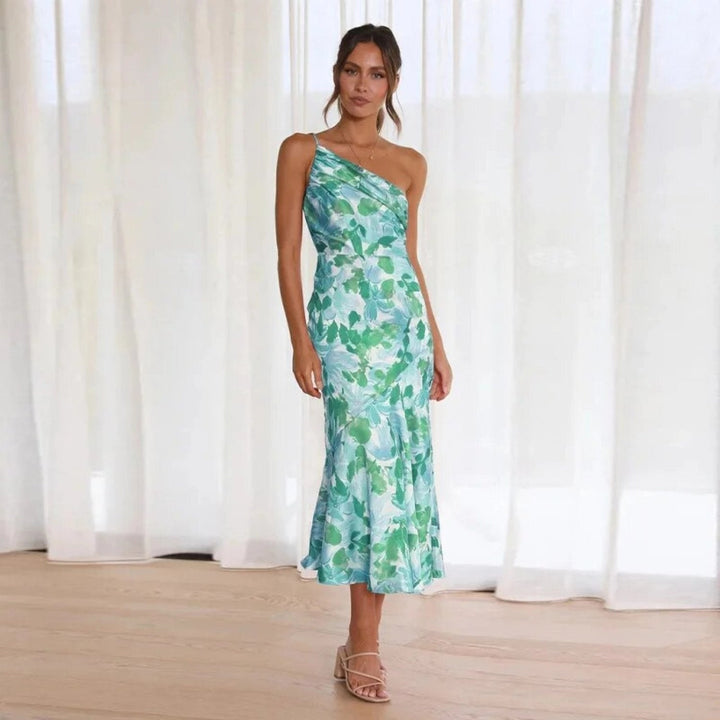 Elegant sleeveless floral midi dress for women, featuring a stylish asymmetric hemline.