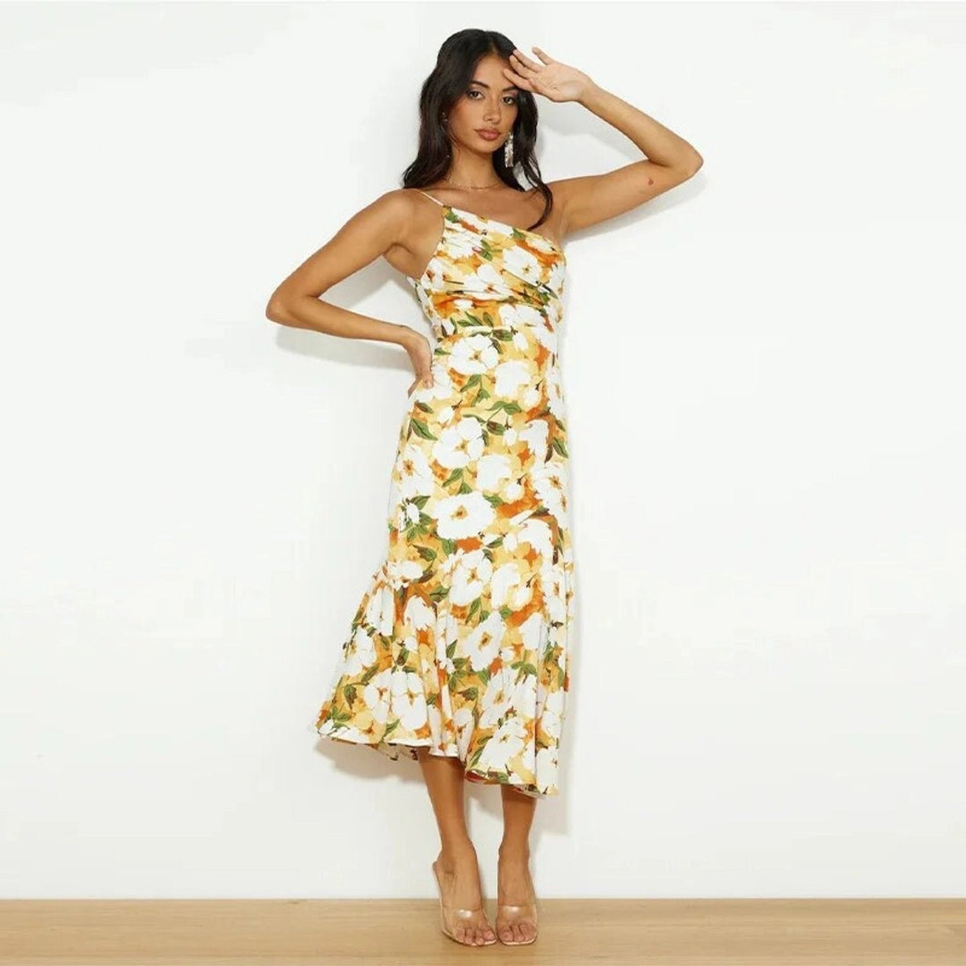 Flowing sleeveless women's floral midi dress, asymmetric hem for a stylish summer look.