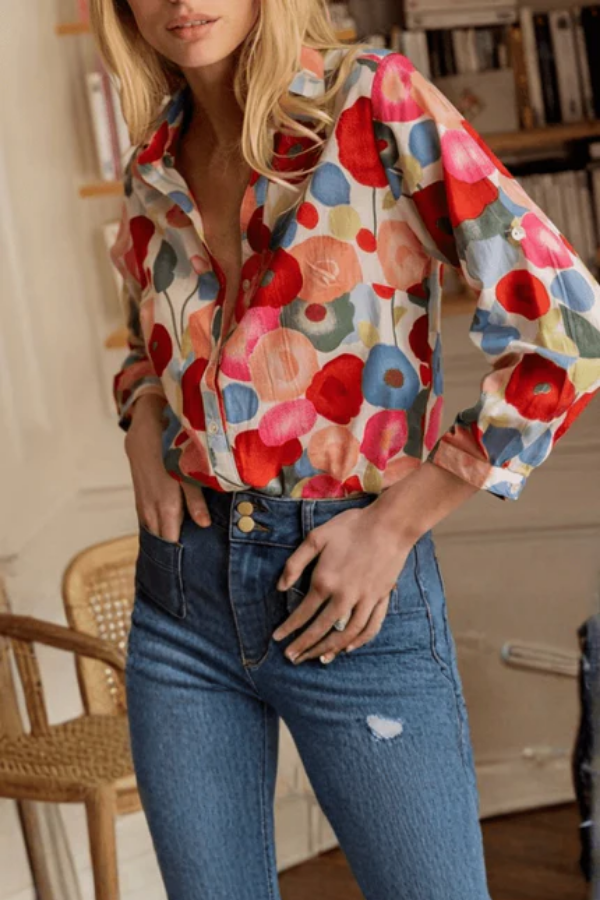 Stylish women's long-sleeve floral button shirt, featuring a vibrant print, ideal for casual or smart casual wear.