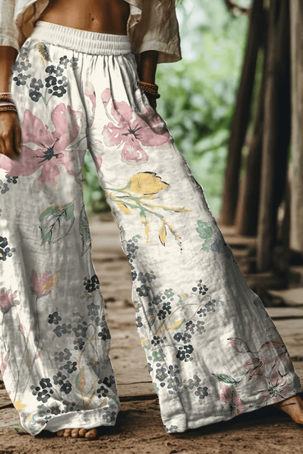 Trendy women's floral cropped pants in a vibrant red and blue, perfect for sunny days.