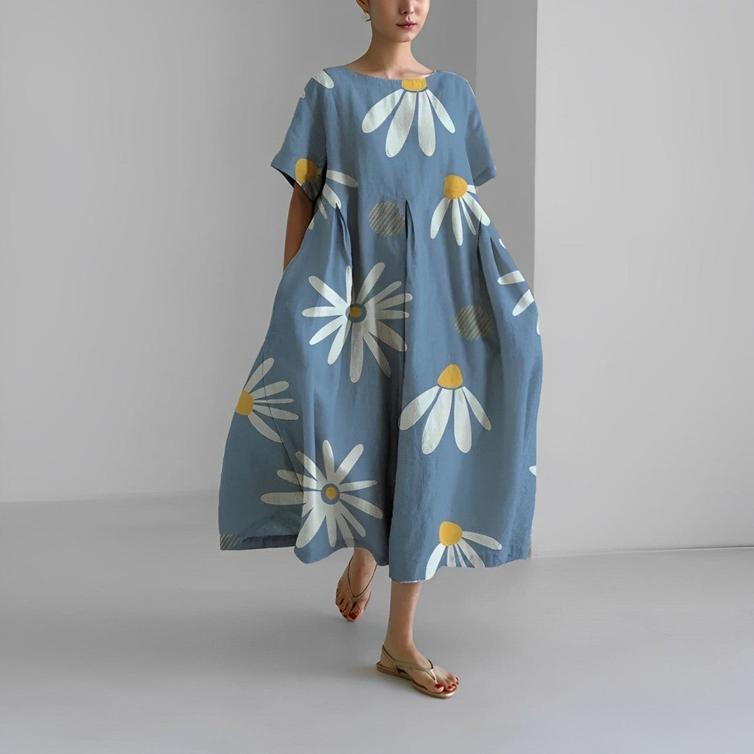 Detail of vibrant floral print on a comfortable women's maxi dress, showcasing artistic summer fashion.