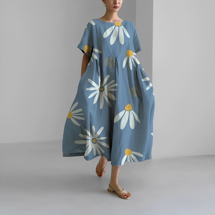 Detail of vibrant floral print on a comfortable women's maxi dress, showcasing artistic summer fashion.