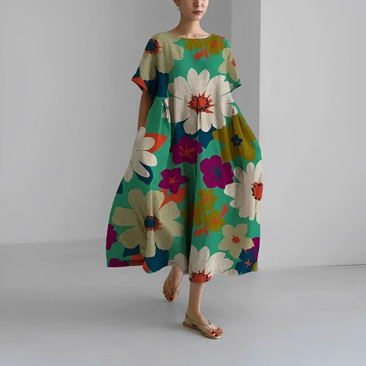 Versatile women's vibrant floral maxi dress, suitable for casual summer outings or elegant resort wear.