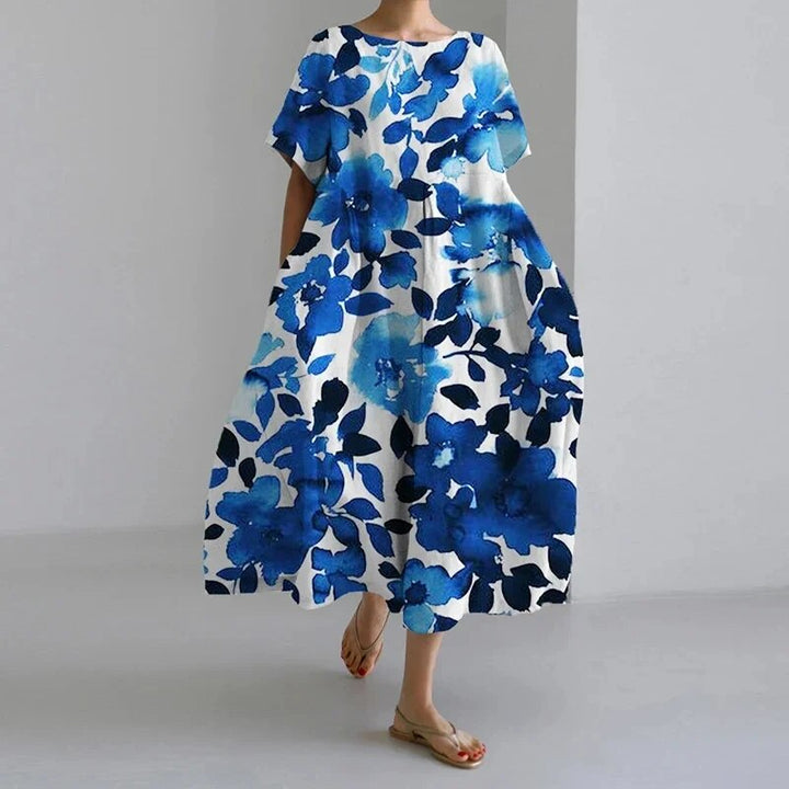 Stunning women's vibrant floral maxi dress, long and flowy, a comfortable and chic choice for summer.