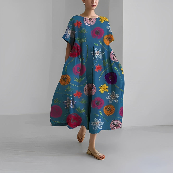 Artistic women's floral maxi dress with a vibrant, eye-catching print, comfortable for chic summer fashion.